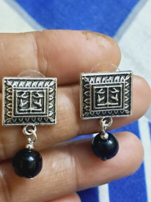 Rectangular tribal-inspired earrings with detailed patterns and a dangling black bead – EAOX0007